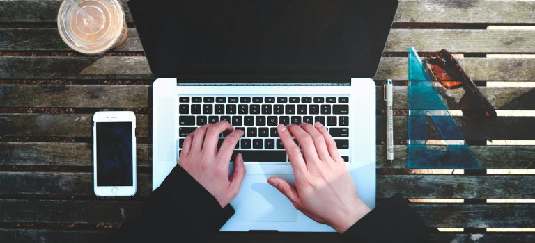 flat-lay photography of person about to use laptop computer